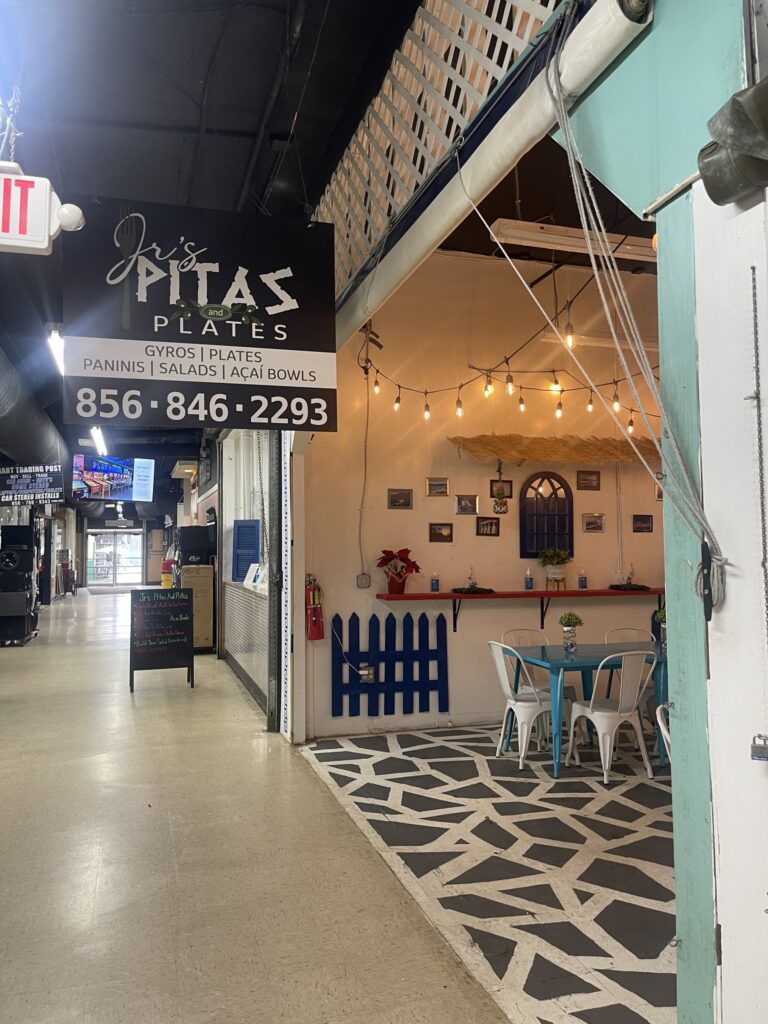 Cozy indoor pita stall with string lights