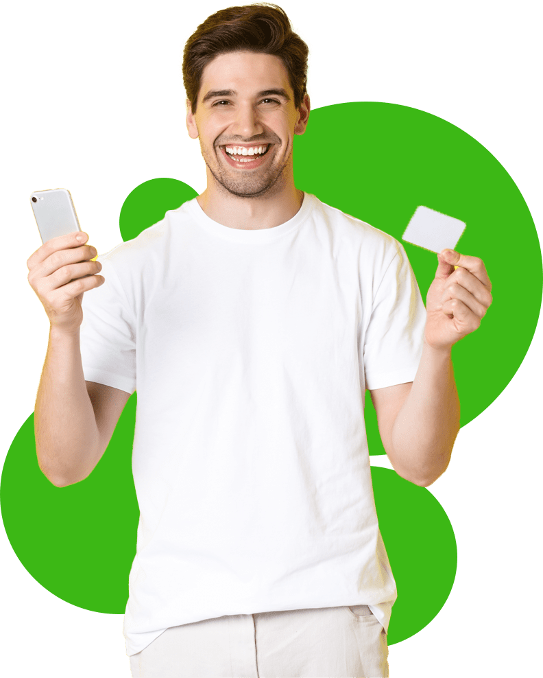 Smiling man holding phone and payment card